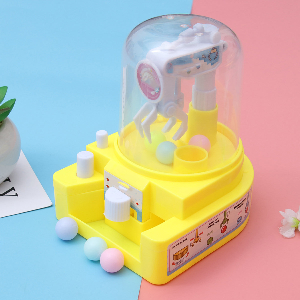 Claw Crane Machine - 1個入りキャンディグラバーマシンクレーン、高級プラスチック製ミニキャッチャー、機械アーム式ハンドヘルドクレーンゲーム、子供向け手と目の協調性向上ゲーム